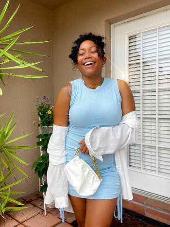 different reviewer in light blue ruched mini dress