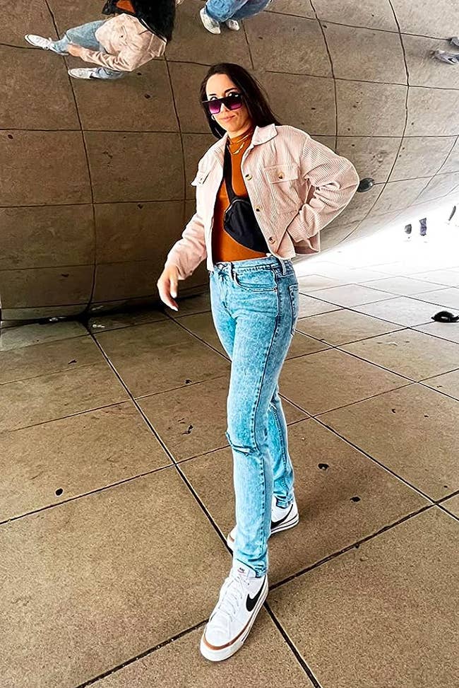 a reviewer wearing the cropped jacket 
