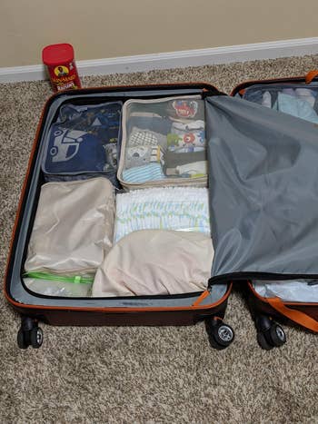 another set of beige packing cubes storing children's clothes