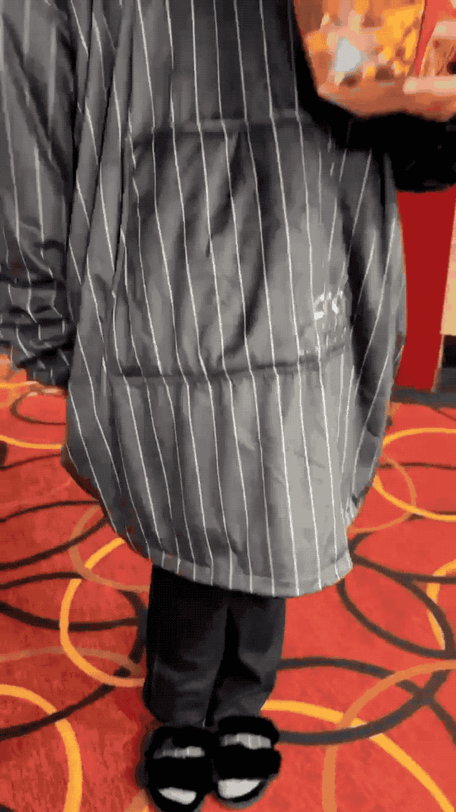 A gif of a moviegoer in the pinstripe lounger which goes past their knees