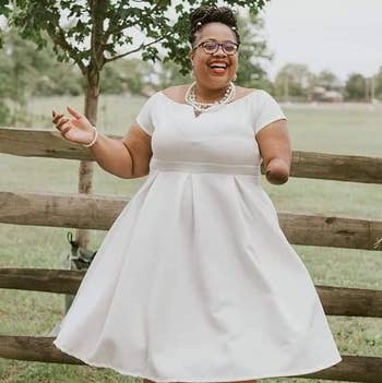 reviewer photo wearing white swing dress and spinning
