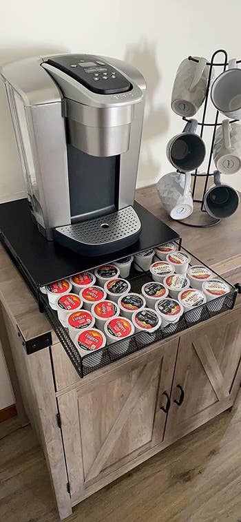 The same setup with the drawer opening show how many K-cups this drawer can discreetly hold