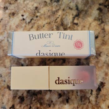Dasique Butter Tint lipstick in Mauve Cream shade, displayed with butter packaging
