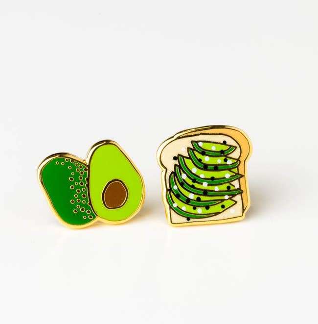 stud earrings where one looks like a halved avocado and the other a piece of toast with avocado slices