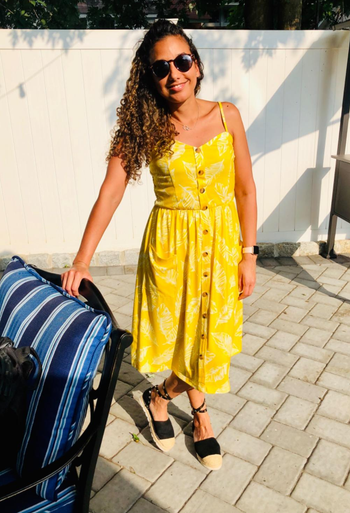 reviewer in the yellow button down midi dress