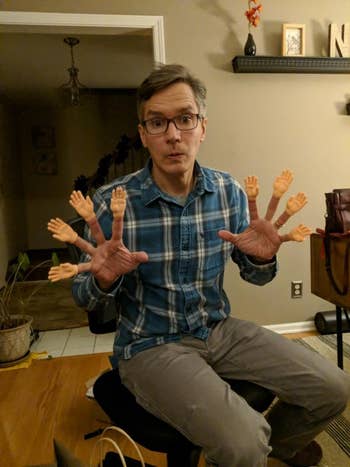 a reviewer with the small hands on eight of their fingers