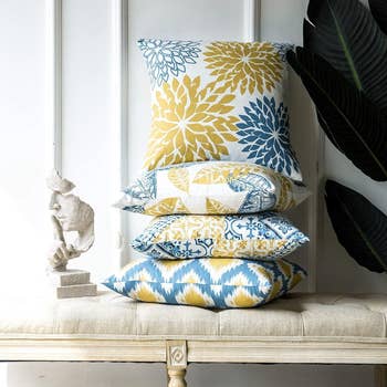 Stack of decorative pillows with various patterns 