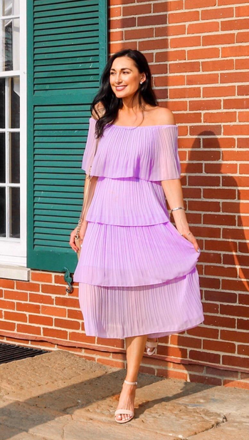 reviewer wearing the dress in lilac