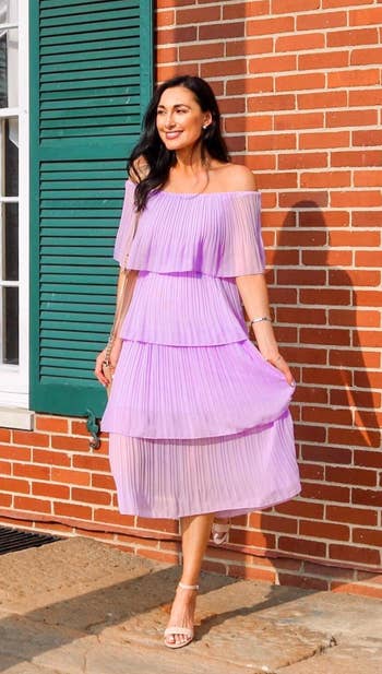 reviewer wearing the dress in lilac