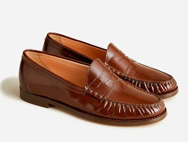 Close up of the loafers in rich caramel with the crinkled leather look along the toe