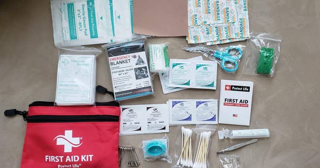 reviewer photo of the various items in the first aid kit
