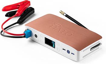 A closeup of the jump starter in rose gold and white 
