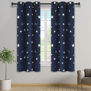 The blackout curtains in navy in a silver foil stars print