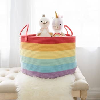 The rainbow basket holding stuffies