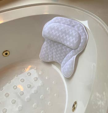 close up of the pillow in a reviewer's tub