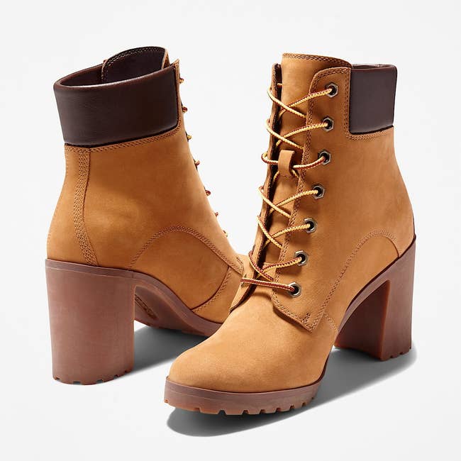 Stylish lace-up ankle boots with artifact heels and lug soles, featuring a brownish leather collar detail, perfect for fashion-forward looks