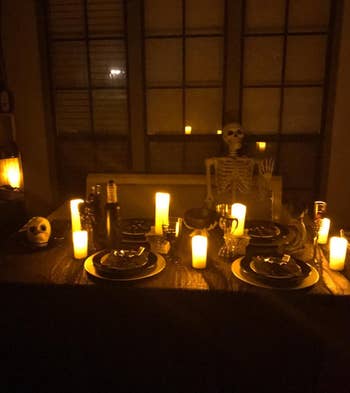 the same reviewer's halloween table setup with the flameless candles at night