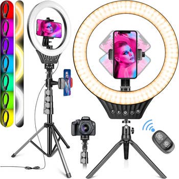 the ring light tripod with a phone in the holder