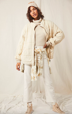 model wearing the coat in white