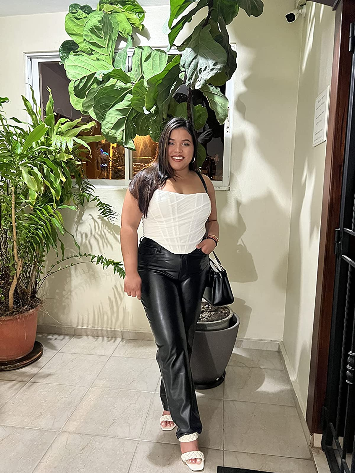 reviewer wearing the strapless top in white