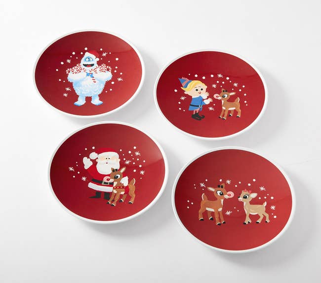 four plates with characters from the classic rudolph the red nosed reindeer movie 