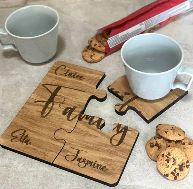 Four coasters with names on them that fit together like a puzzle