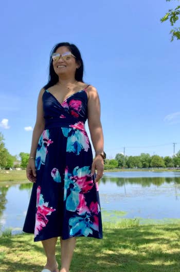 another reviewer wearing navy floral dress