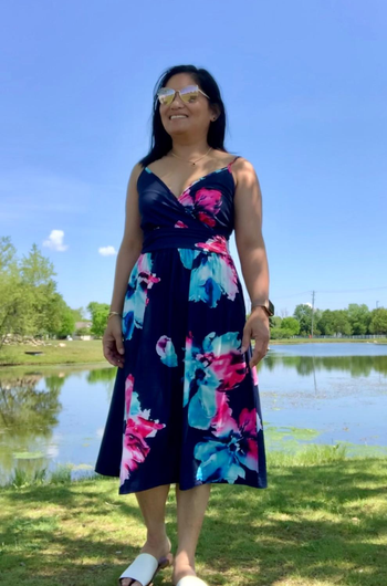 another reviewer wearing navy floral dress