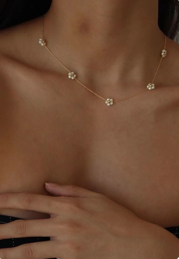 model wearing daisy-inspired choker necklace