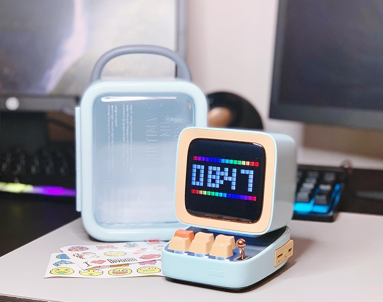 The speaker next to its carrying case.