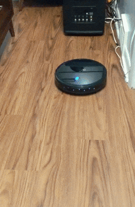 reviewers robotic vacuum cleaner moving across a wooden floor cleaning