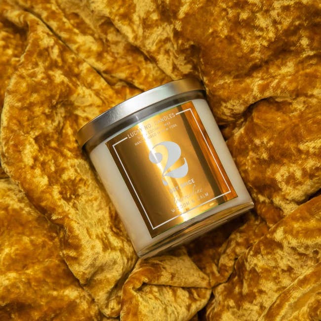 the dry spice candle on a yellow velvet background