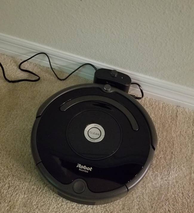 a reviewer photo of the vacuum charging on the included charging dock 