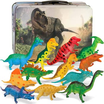 the dinosaurs in front of the metal lunchbox