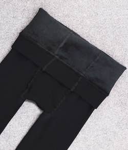 the black leggings rolled down showing fleece lining
