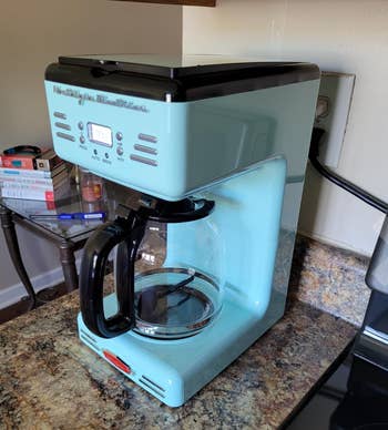 aqua colored retro style coffee maker with a clear pot 
