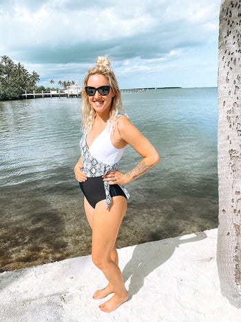 reviewer wearing the wrap v-neck suit in black and white