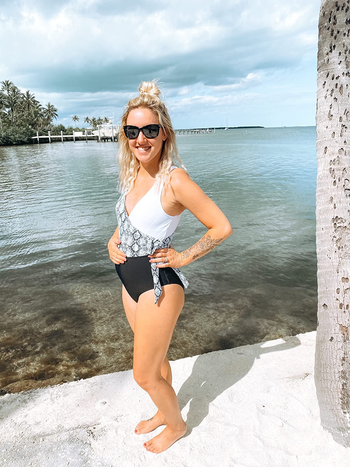reviewer wearing the wrap v-neck suit in black and white