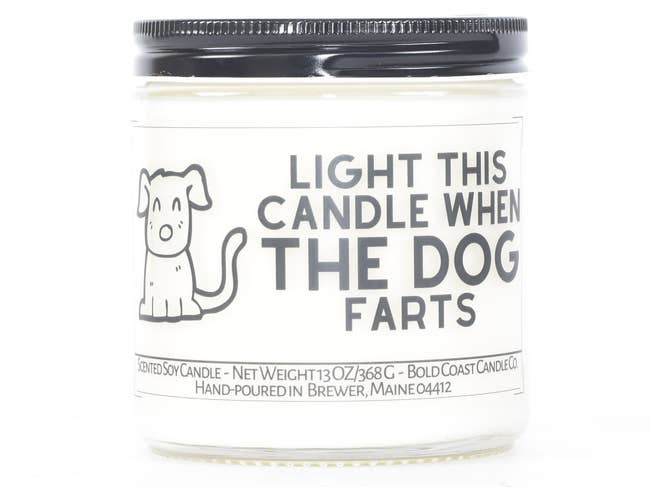 Black and white candle that reads 