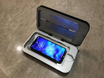 reviewer's phone in open sterilizing case