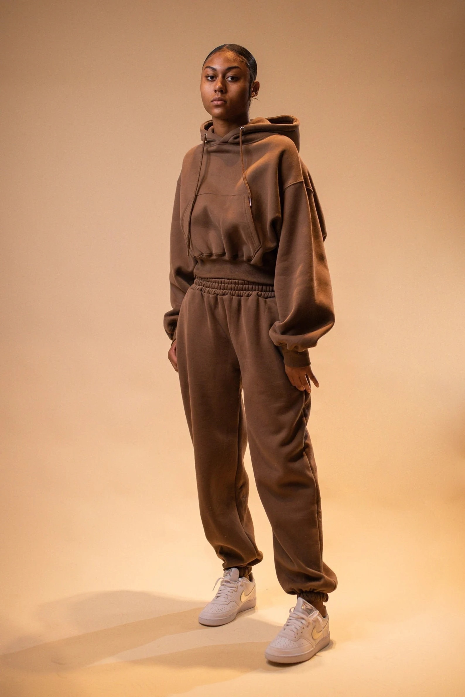 model wearing the brown sweat set