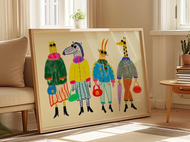 Framed artwork successful a cozy country depicting colorful, whimsical animals dressed successful quirky, fashion-forward outfits