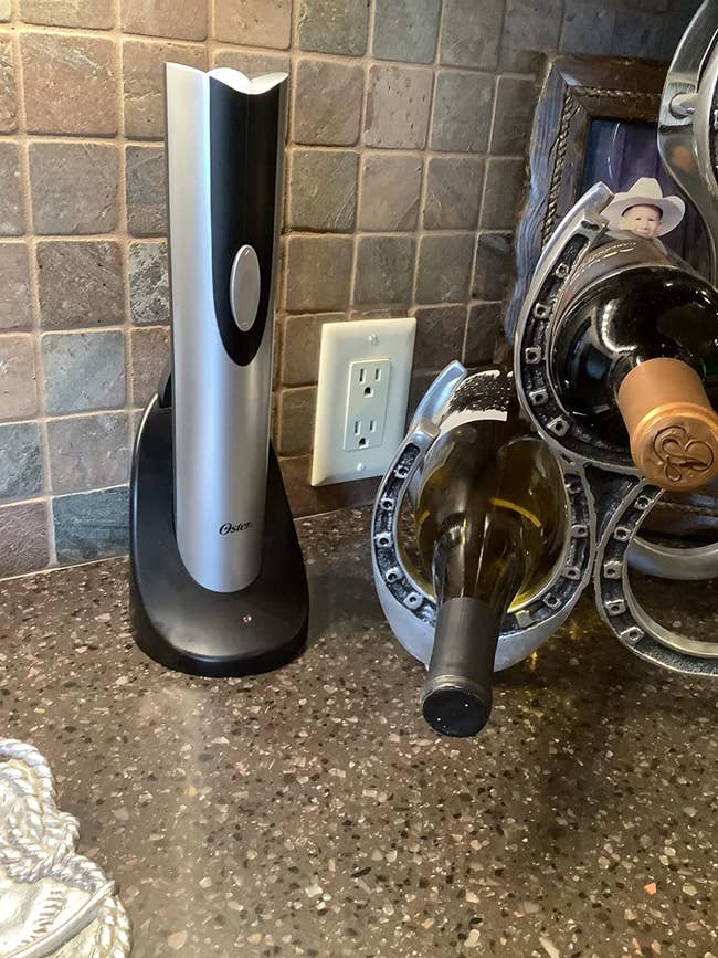 a reviewer photo of the wine opener on a kitchen counter