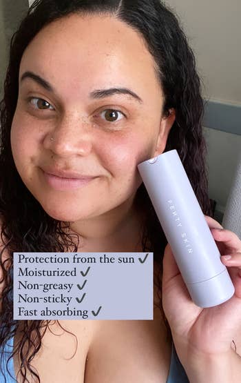 buzzfeed editor holding the bottle of fenty skin moisturizer with text overlay that says, 
