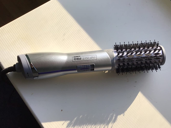 a reviewer photo of the hot hair brush 