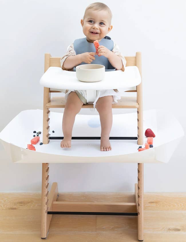 A baby in a highchair and a 