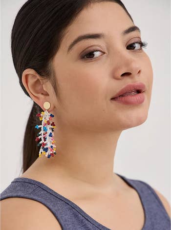 model wearing the same earrings