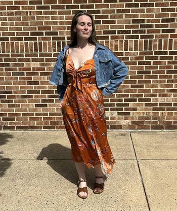 Person successful floral formal and denim overgarment poses confidently extracurricular connected a sunny day