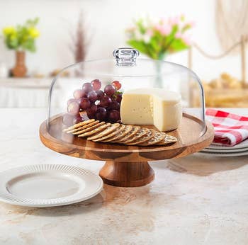 cake stand holding charcuterie