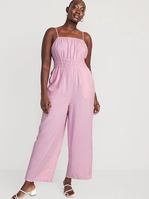 model wearing the smocked jumpsuit in light pink